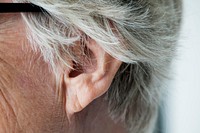 Closeup of elderly woman&#39;s ear