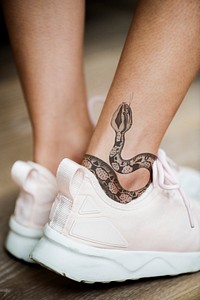 Closeup of ankle tattoo of a woman