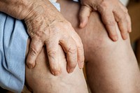 Elderly woman suffering knee pain
