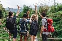 Group of friends hiking through a jungle