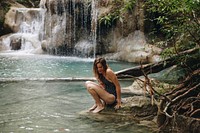 White woman enjoying the waterfall
