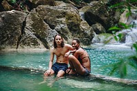 Couple enjoying the waterfall