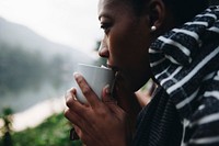 Woman enjoying morning coffee in nature