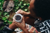 Woman enjoying her morning coffee in nature