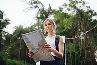 Woman following a map in nature