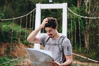 Caucasian man looking at a map travel and explore concept