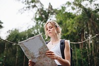Caucasian woman looking at a map travel and explore concept
