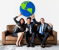 Business people holding global icon