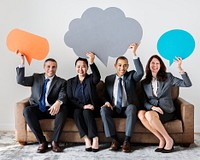 Business people sitting together with icons