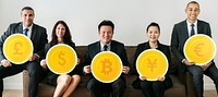 Business people holding currency icons