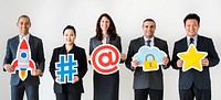 Business people standing and holding icons