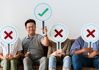 Group of people holding true &amp; false icons