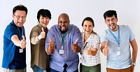 Workers standing and showing their thumbs up together