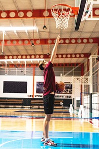 Caucasian teenage boy on a basketball goal and aim concept