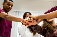 Study group classmates joining hands together teamwork concept