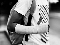 Injured young man with arm support