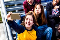 Group of school friends having fun and taking a selfie