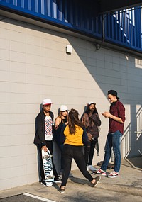 Group of diverse teenagers hanging out together