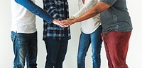 Diverse people joining hands together teamwork and community concept