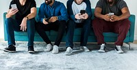 Group of diverse men using mobile phone social media and internet concept