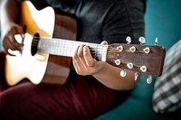 Man playing an acoustic guitar