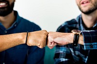 Closeup of men fist bumping