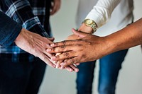 Diverse people joining hands together teamwork and community concept