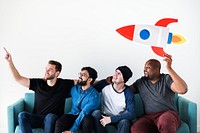 Group of diverse friends sitting on couch with spaceship icon