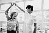 Cheerful couple enjoy dancing together