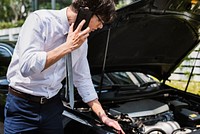 Man calling for help to fix his car