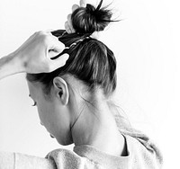 Woman making hair bun