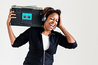 A woman listening to the music from a radio