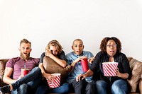 Group of friends terrified watching thriller movie