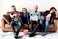 Sad group of friends holding movie and film objects
