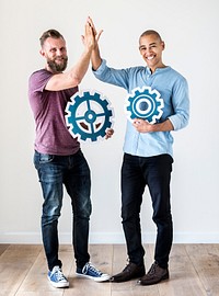 Two casual man holding cog icon