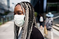 Portrait of black woman wearing mask