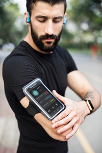 A man wearing a smartphone armband