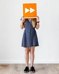 Girl holding orange forward icon