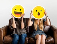 Cheerful people holding emoticon icon