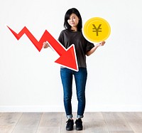 Unhappy Asian woman holding a Japnese Yen and financial decrease arrow