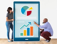 Diverse couple of people holding a tablet