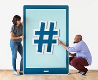 Diverse couple of people holding a tablet