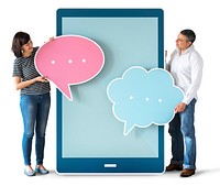 Diverse people holding speech bubbles and tablet