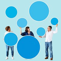 Diverse people holding colorful blank circles