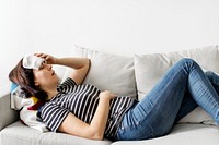 Woman sick at home on the couch