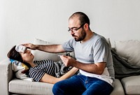 Couple sick at home on the sofa