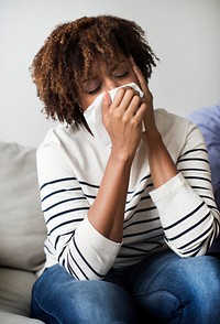 Woman sick and sneezing