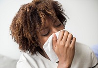 Woman sick and sneezing
