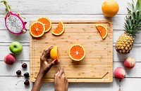 Cutting up healthy fresh oranges