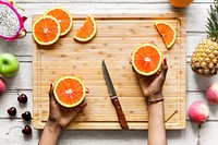 Cutting up healthy fresh oranges
